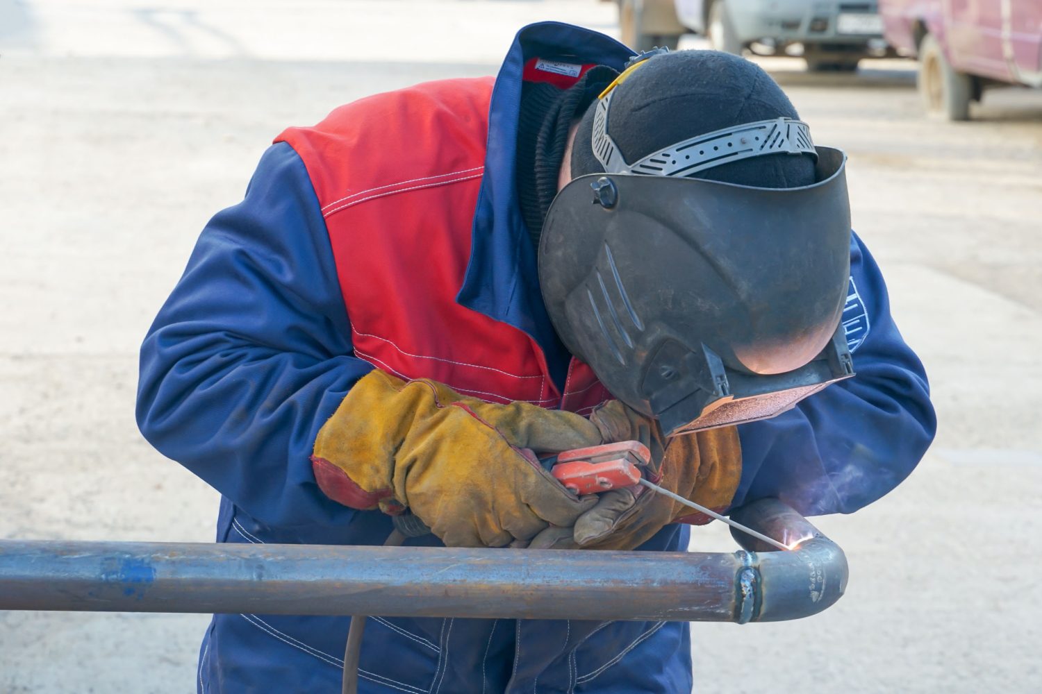 Pipeline, butt weld, electric arc welding, Welder welds the pipe. Manual arc welding of technological pipelines DN50 for an oil refinery in Russia